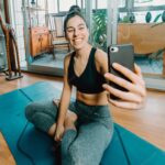 attractive-fitness-young-woman-sitting-lotus-pose-taking-selfie-doing-yoga-with-online-class-home-entertainment-education-internet-healthy-lifestyle-concept-during-free-time_146482-4475